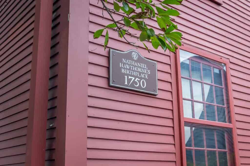 Red building with sign reading \"Nathaniel Hawthorne\'s Birthplace\"