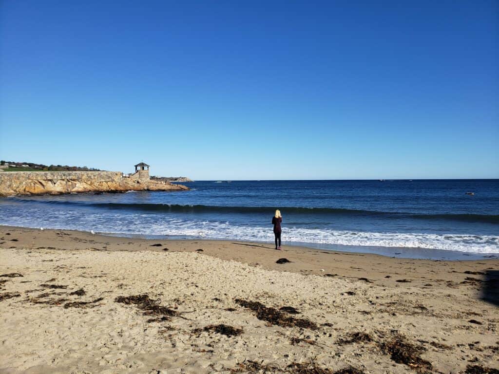 A sandy beach with blue water