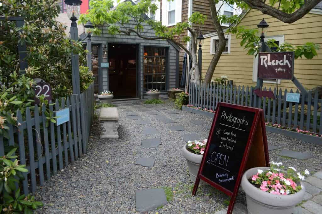 A driveway with a menu sign outside