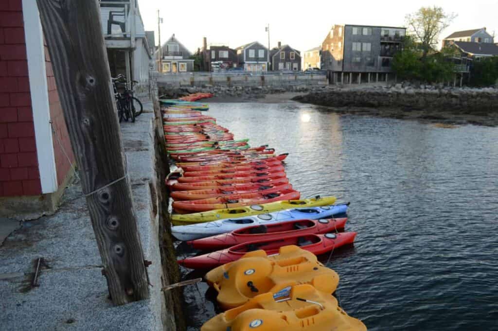 A row of many boats in a harbor