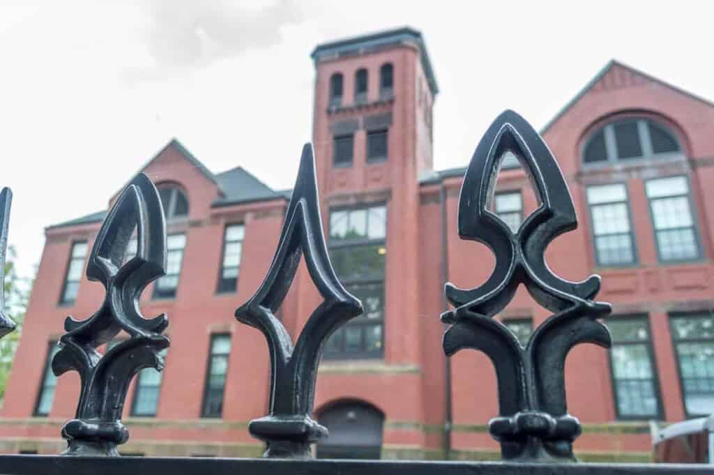 Gothic wrought iron fence around a building