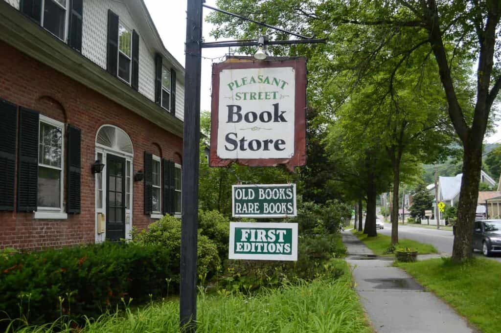 A building front with a sign outside saying \"Book Store\" in Woodstock Vermont