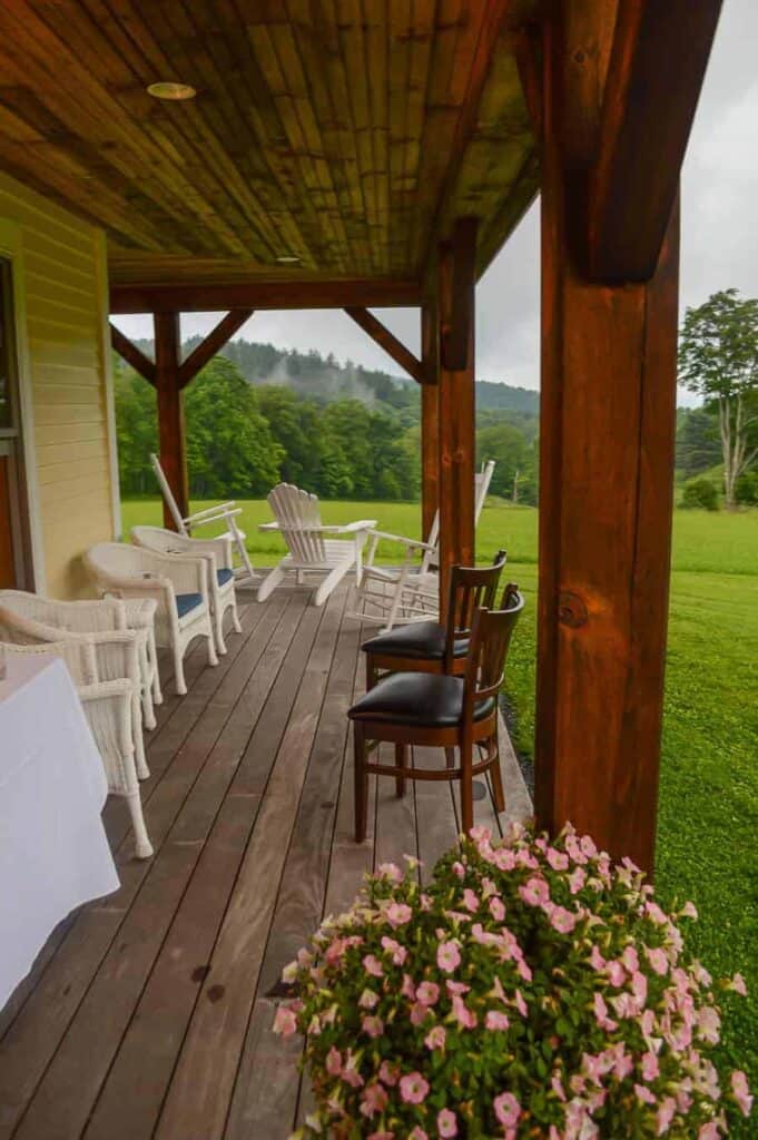 Tables and chairs on an outside wooden deck in Woodstock Vermont