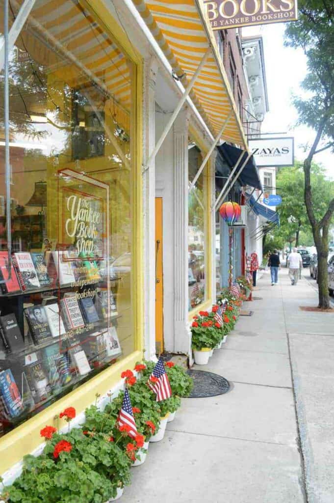 Block of stores with books on display in the window in Woodstock Vermont