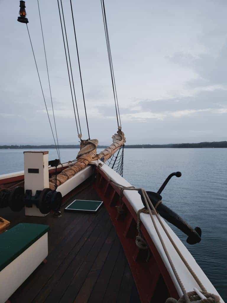 A wooden boat in a body of water.