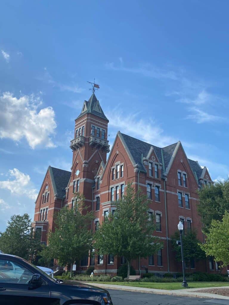 Huge building with many stories and a tower