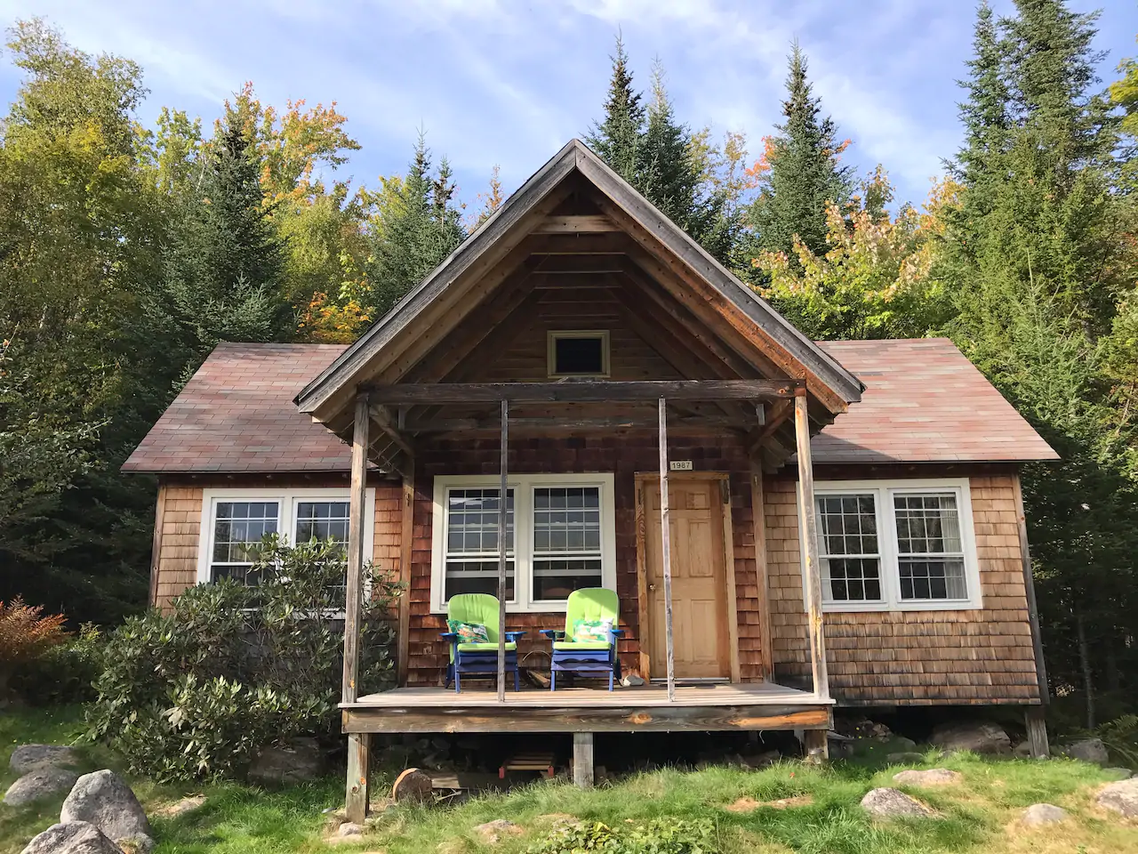 Mountain cabin with porch with 2 chairs