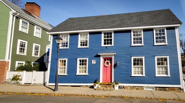 A blue house with a red door