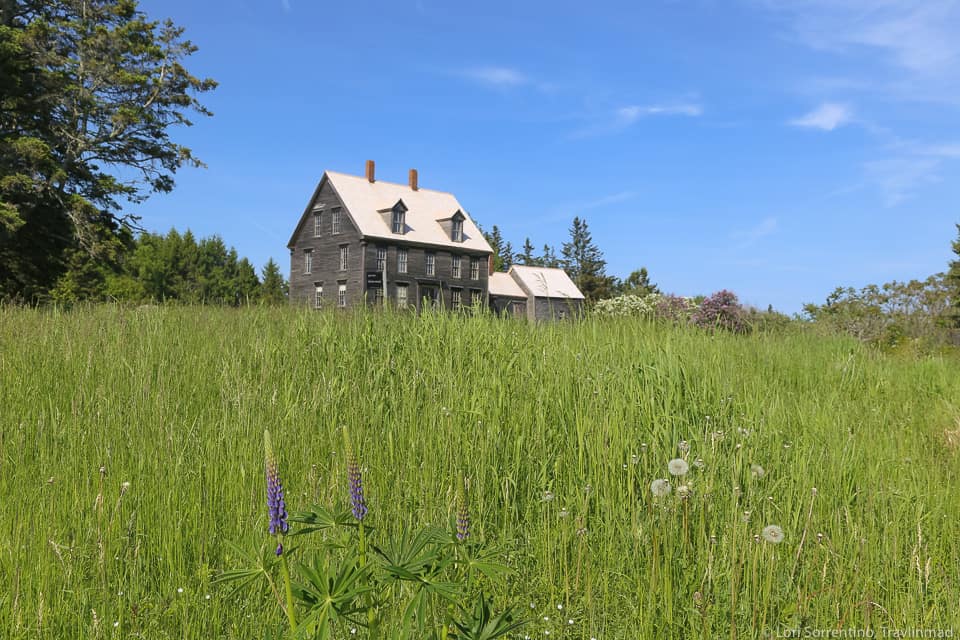 House in the distance behind a field