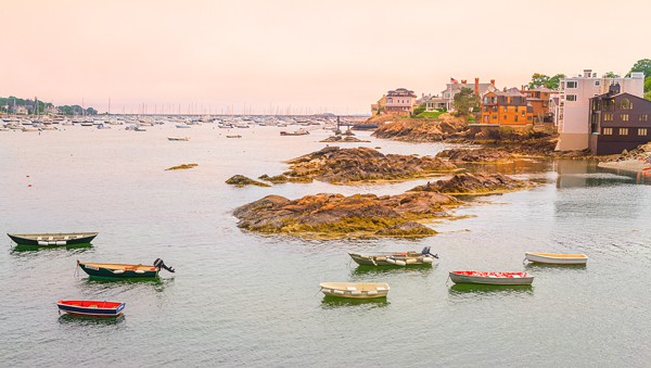 Boats in front of a rocky coast