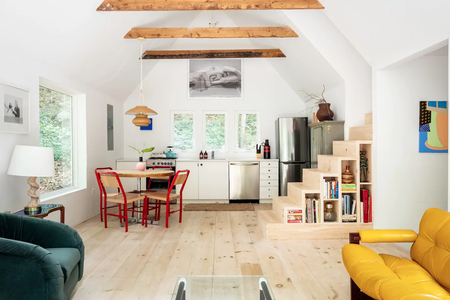 White room with red kitchen table and chairs