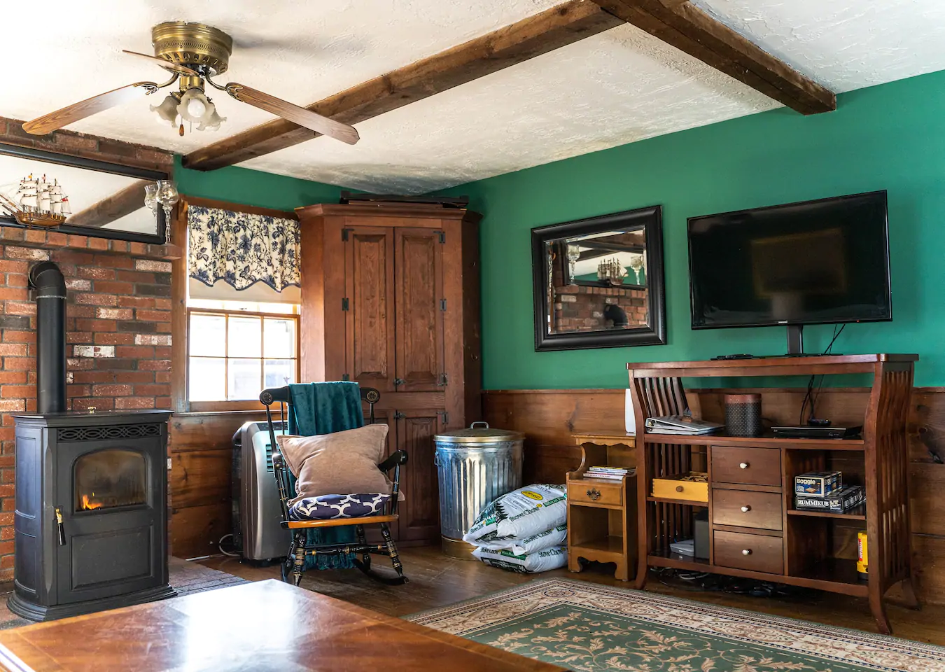 Family room with green walls and traditional furniture