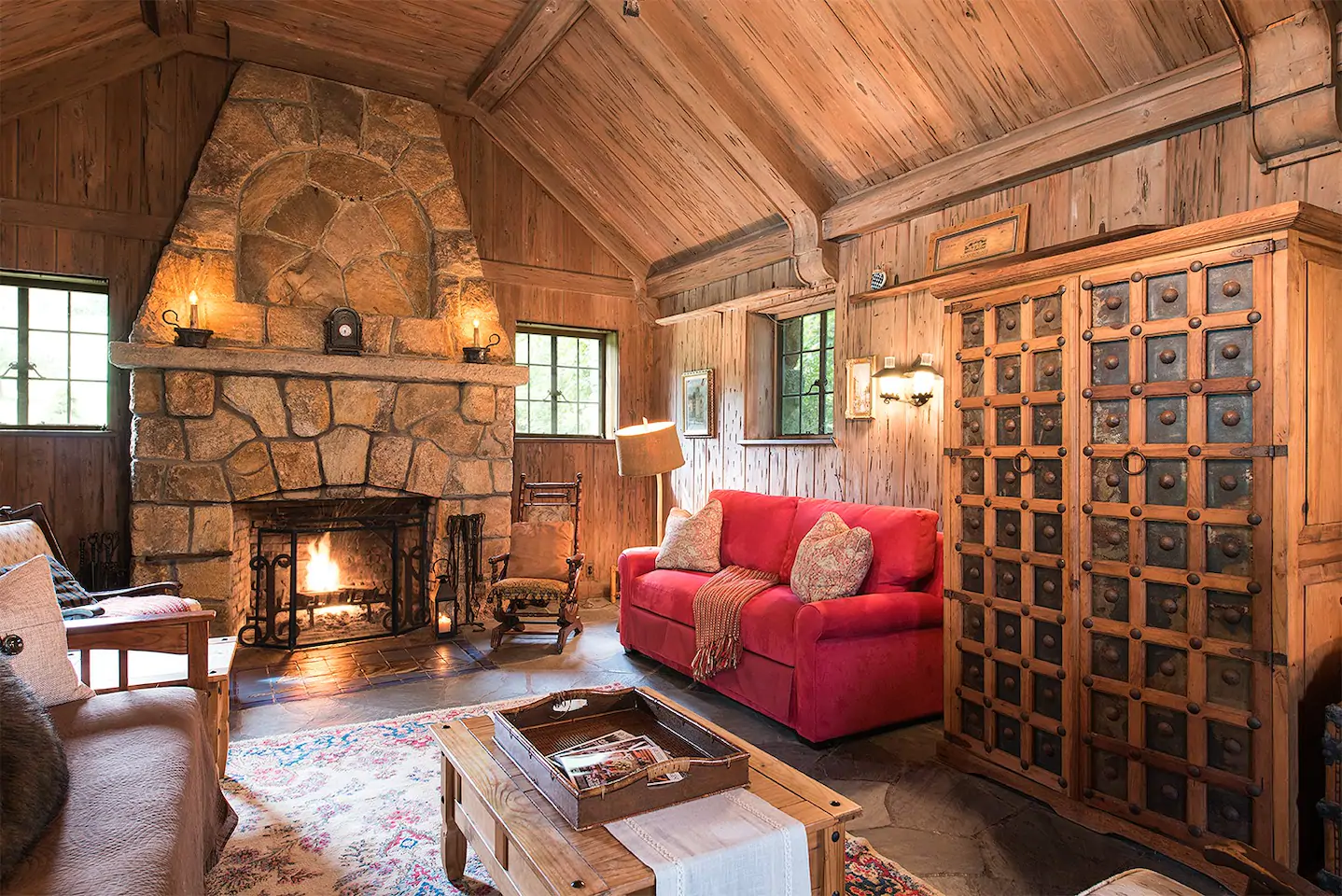 Cozy cabin interior with sofa and fireplace