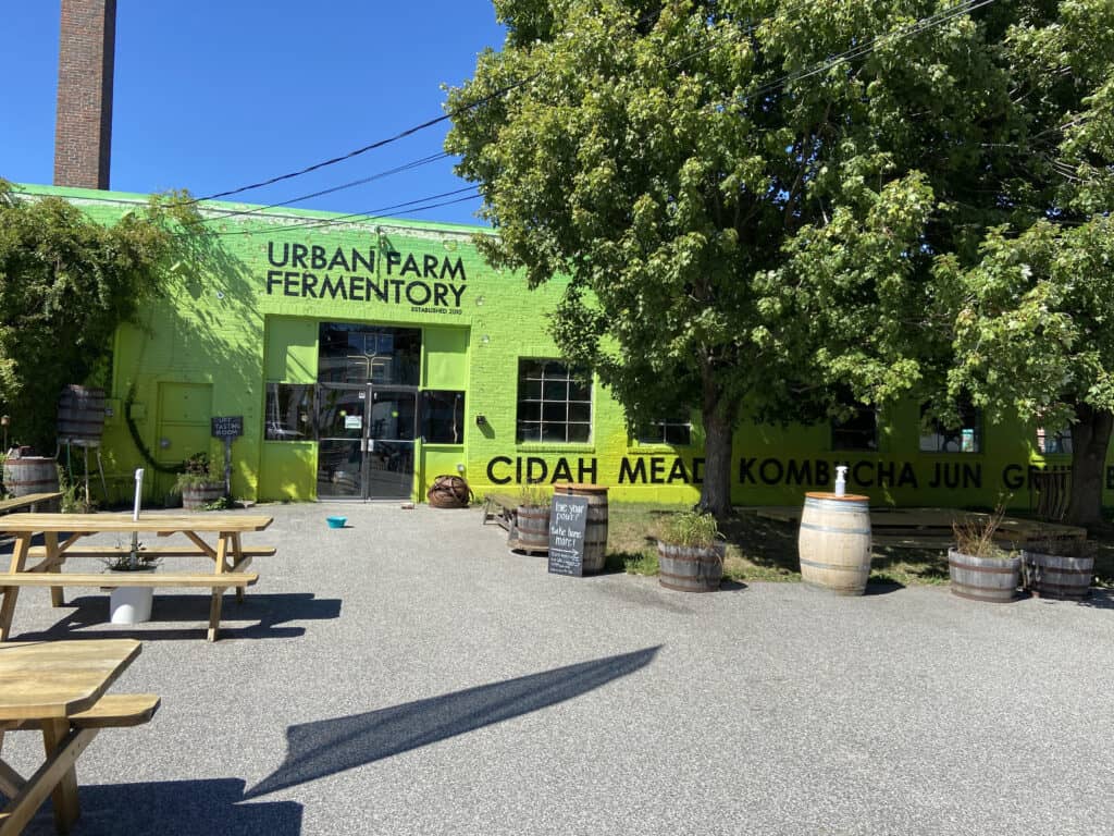 A lime green building with the words 'Urban Fermentory"