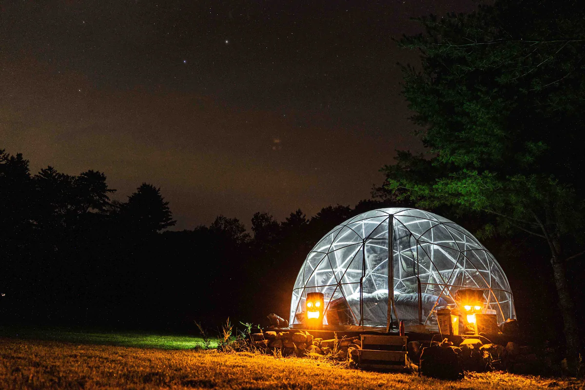 Dome hut in the woods at night