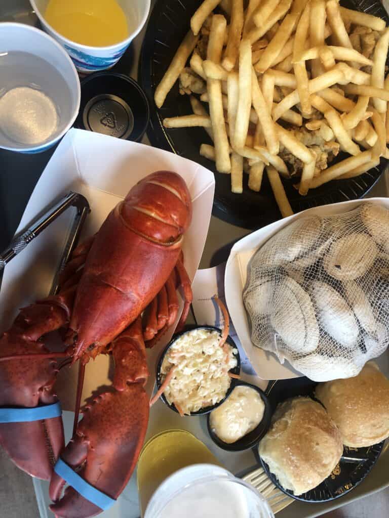 A plate of food on a table, with Lobster and Seafood at one of the most popular lobster fry shacks in Maine