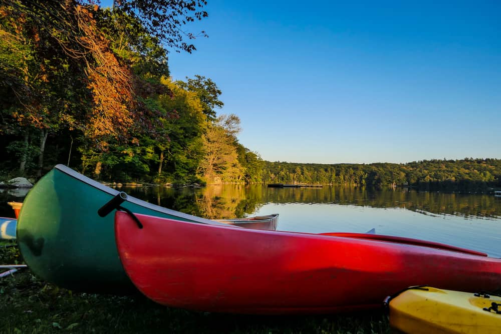 A red boat next to a body of water