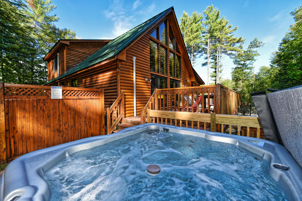 A hottub outside of a mountain chalet