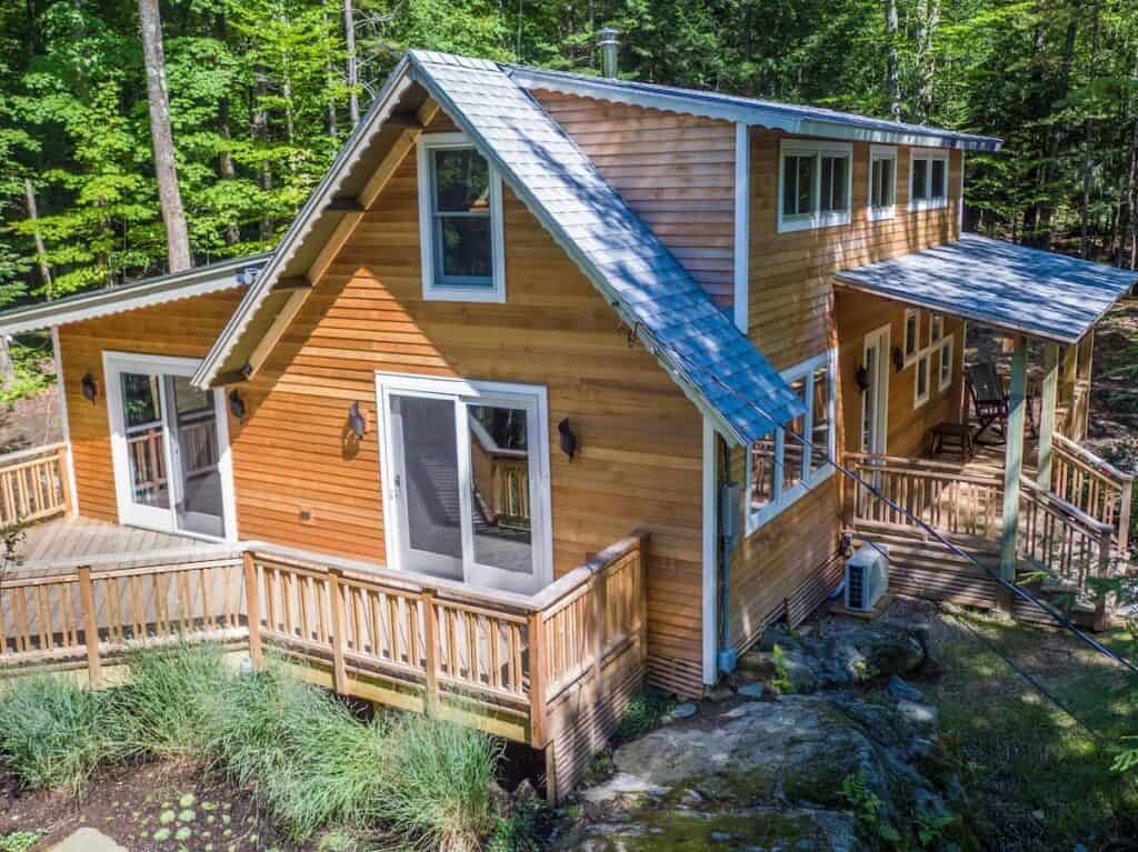 Wooden chalet with wooden porch railing