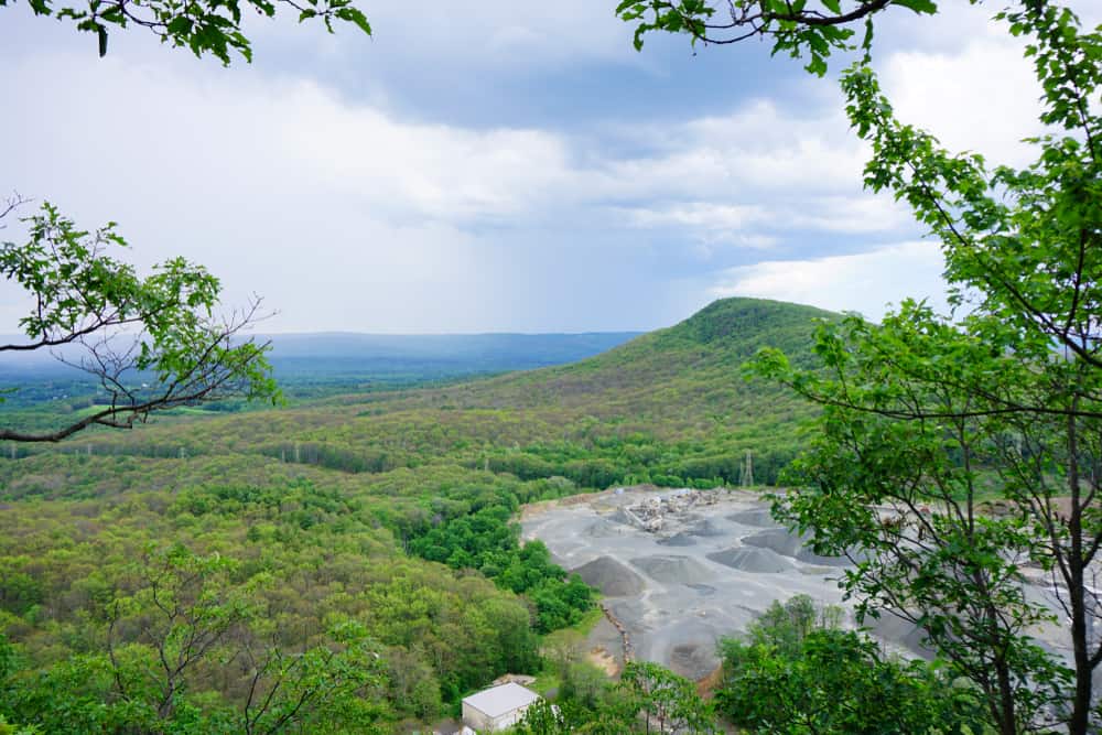 Aerial view of a hilly landscape with greenery in the Pioneer Valley of Western MA.