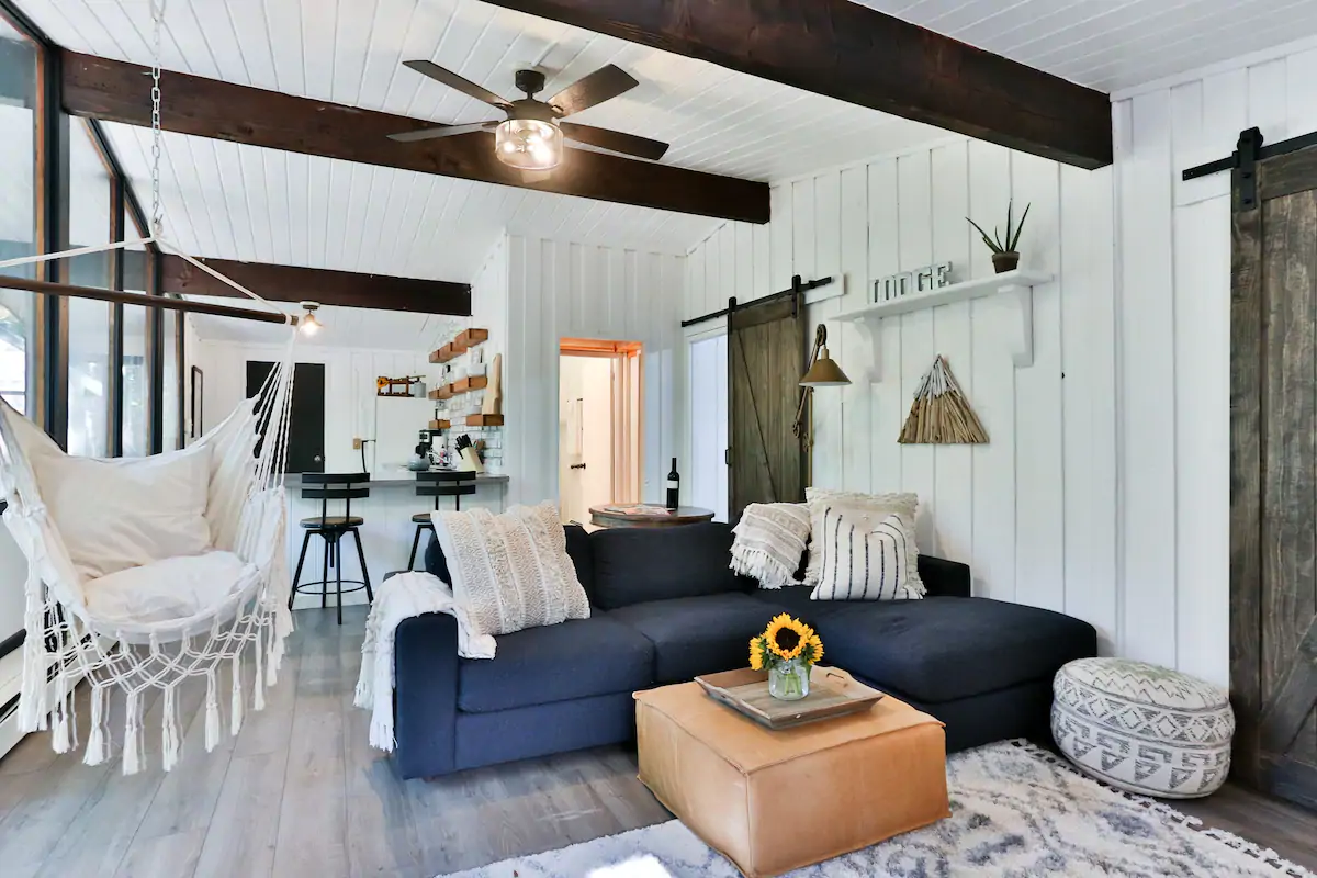 A living room filled with furniture including a royal blue couch