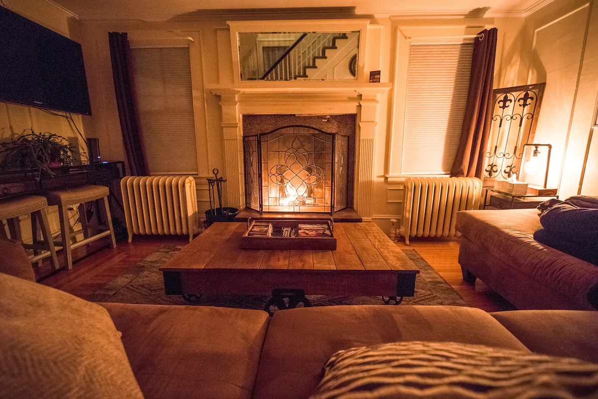 A living room filled with furniture and a fire place