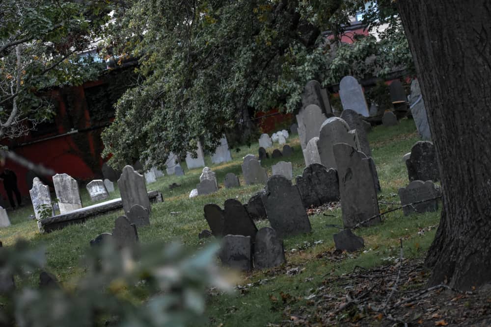 A historic haunted graveyard in Salem Massachusetts on an overcast day