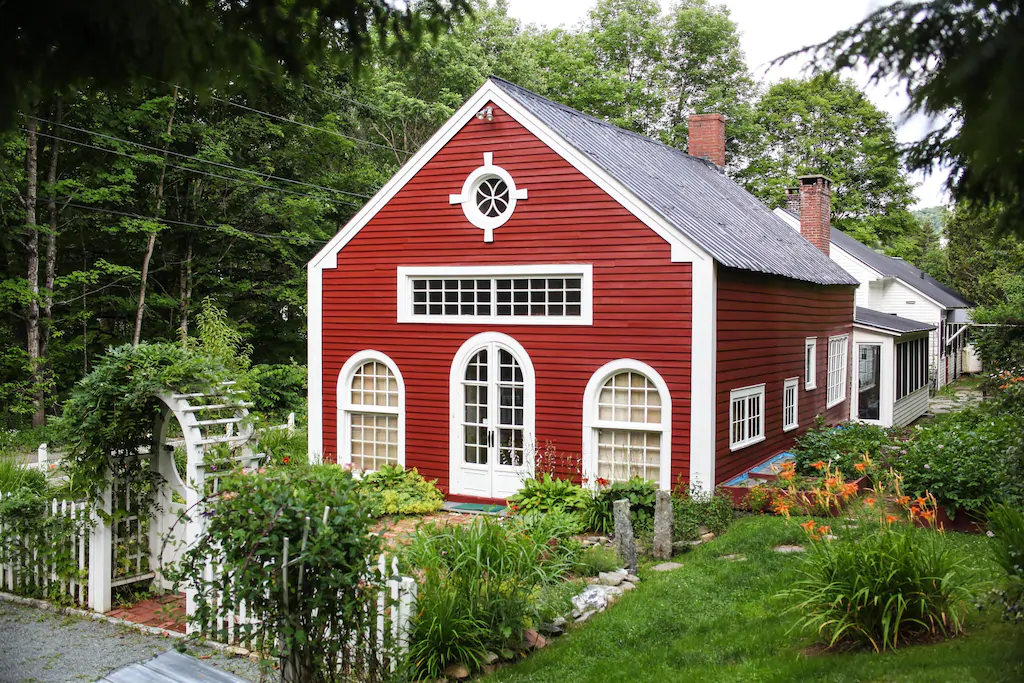 Red building with white trim is one of the top vacation rentals in New England