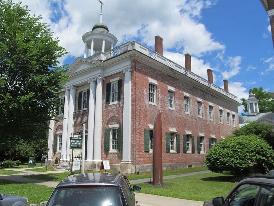 Large brick building with white columns in front