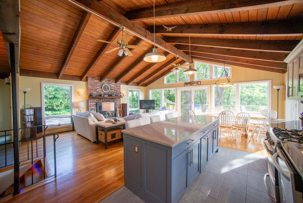 A sunny large kitchen with Cathedral ceilings and an island kitchen piece of furniture