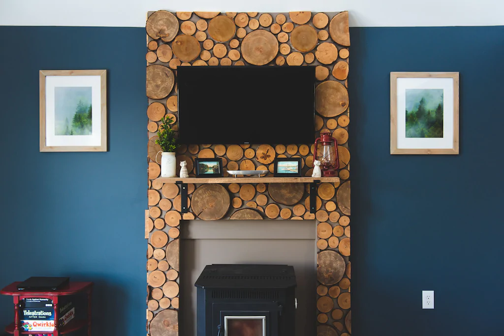 Art Deco fireplace on a blue wall in a New England vacation home on VRBO