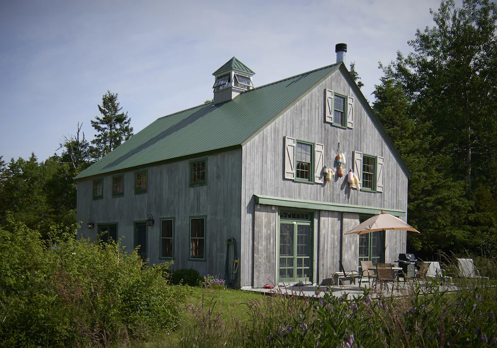 Grey Cape Cod style two story house at a popular New England vacation rental in Maine