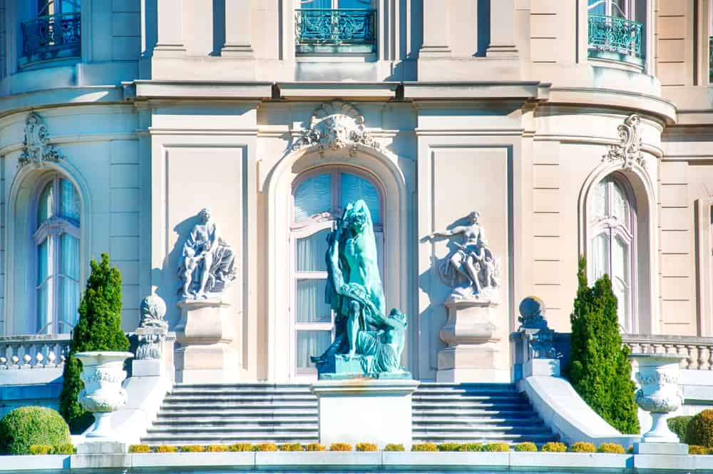 Greek styled statues in front of a building in Rhode Island