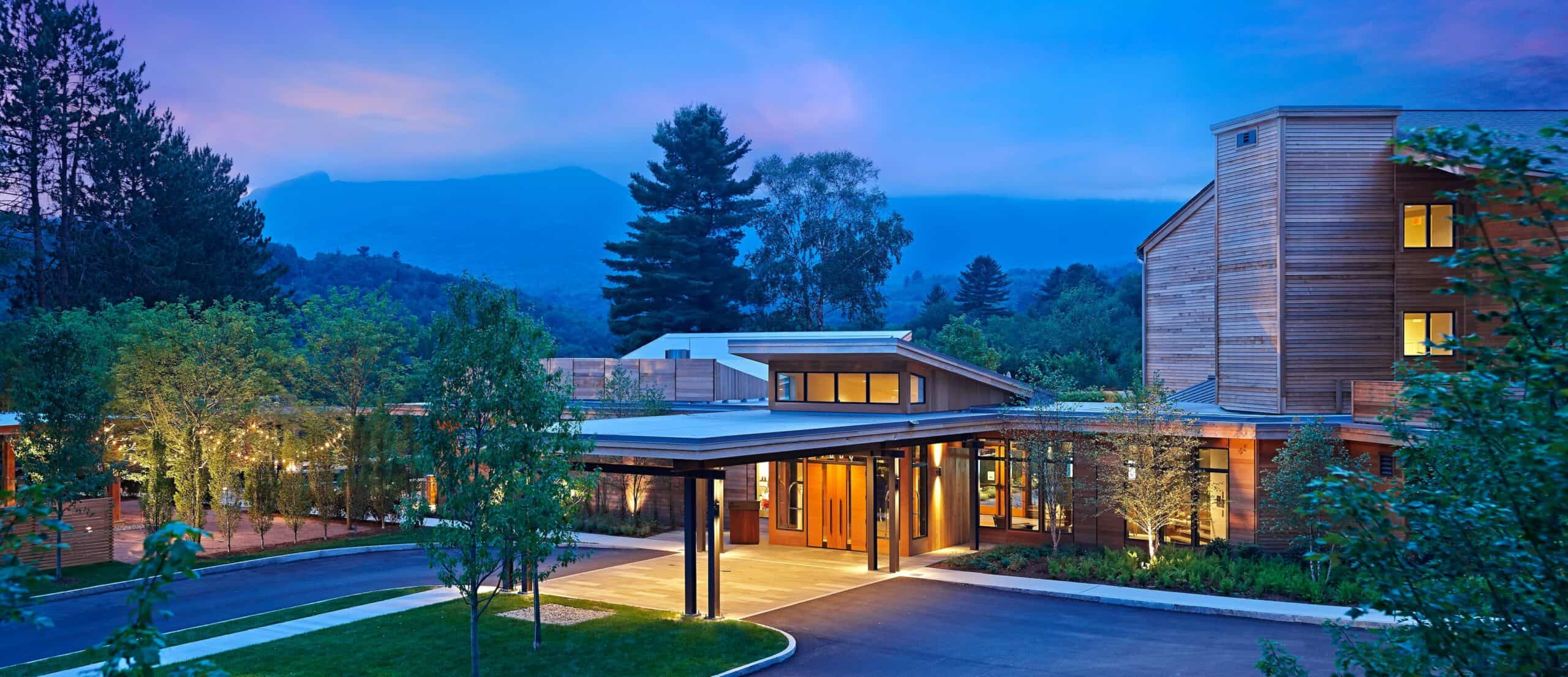 Modern building with warm lights at sunset