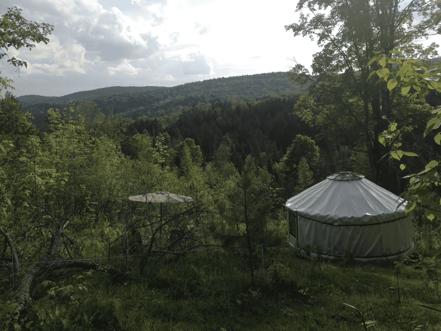 White yurt overlooking the mountains