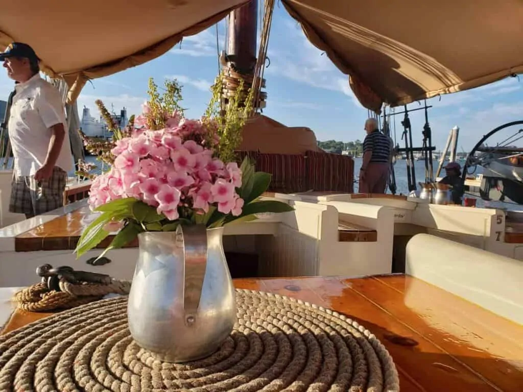 Flowers sit on a table on a historic schooner cruise in Maine