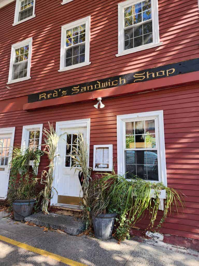 Historic red building that houses Red's Sandwich Shop in Salem, Massachusetts