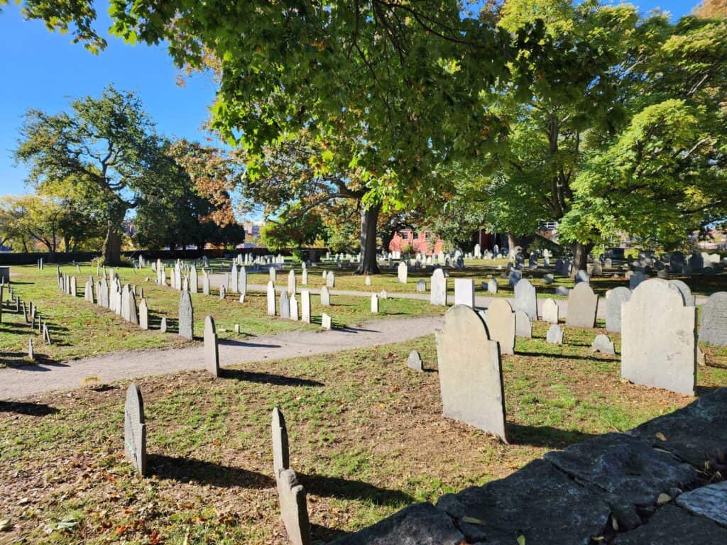 A photo of a potentially haunted Salem, Massachusetts cemetery during fall
