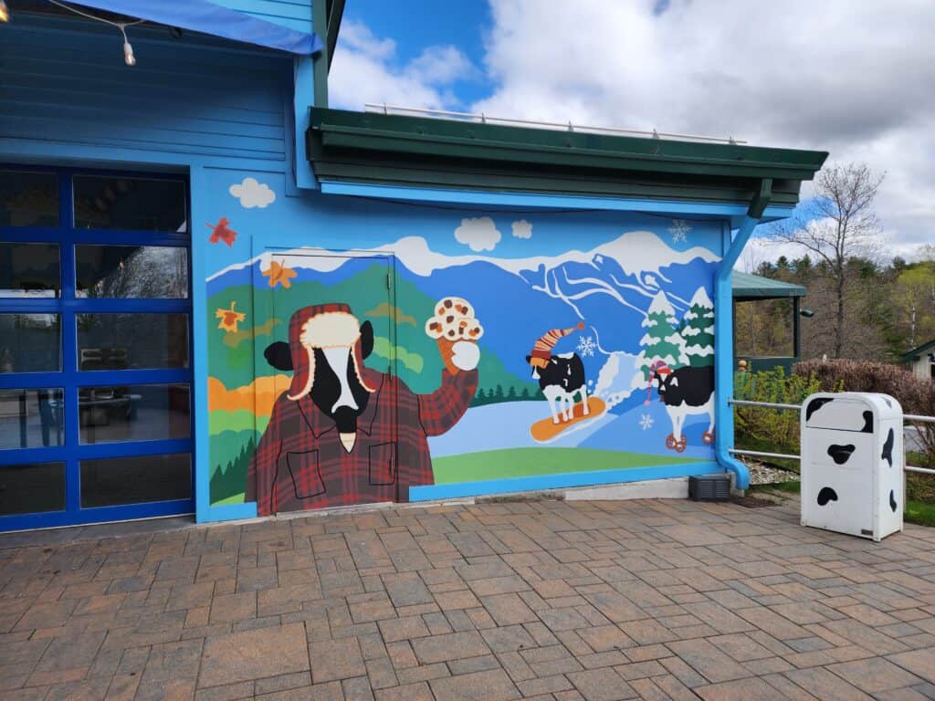 a fun cow mural outside ben and jerrys ice cream factory waterbury vermont