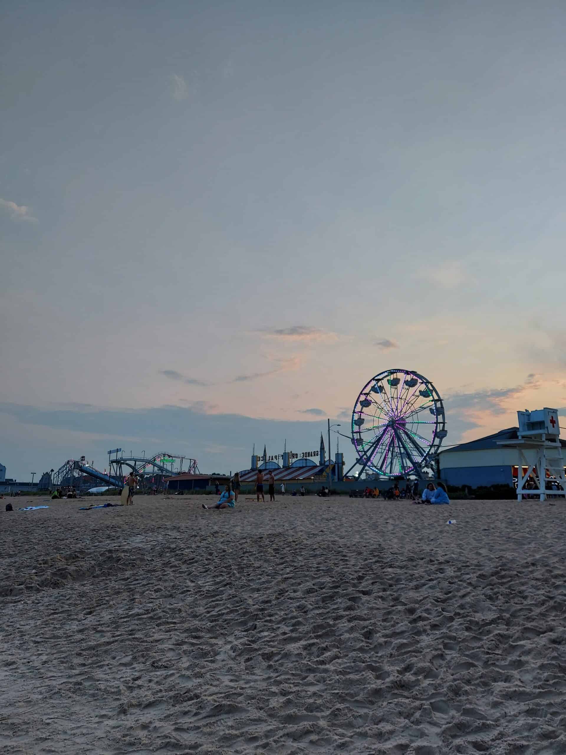 dusk over the ferris wheel and rides on the beach, old orchard beach maine