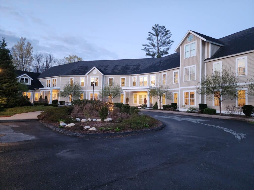 exterior image of a modest hotel evening hours in late spring