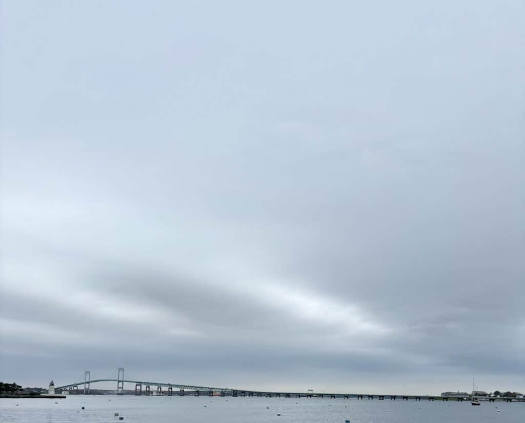 A sweeping view of the Claiborne Pell Newport Bridge under a grey sky
