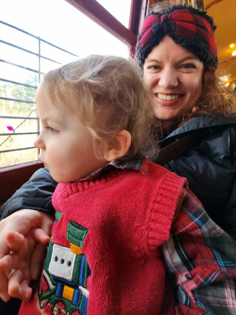 A woman and toddler on the Christmas trolley in Kennebunkport, Maine