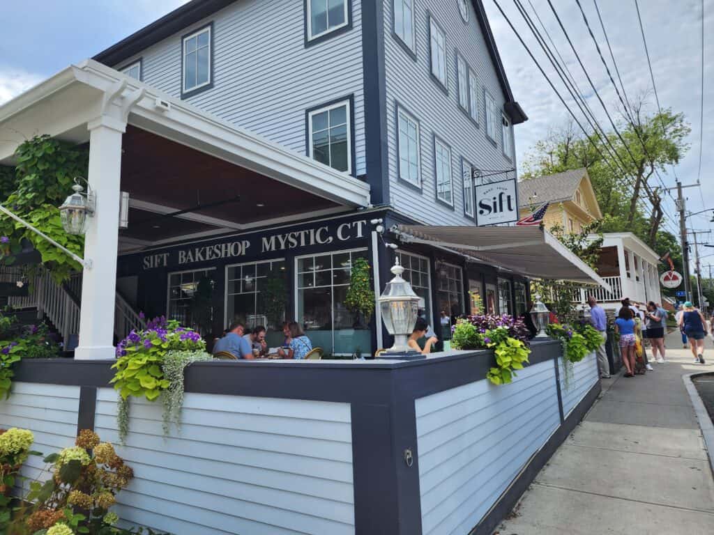 exterioir of shift bakeshop mystic ct, a welcoming patio with plants