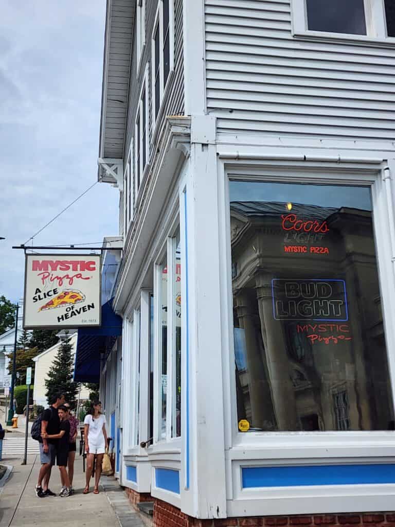 sign and window of Mystic Pizza restaurant 