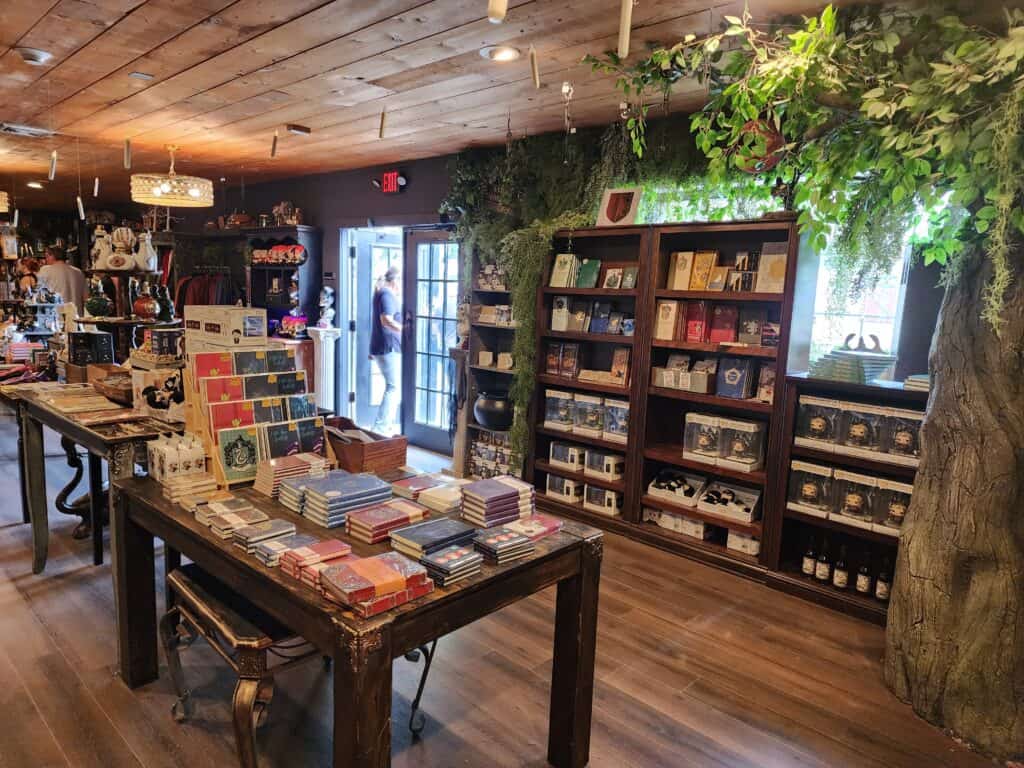 interior of a magical bookshop that is decorated with lots of indoor greenery