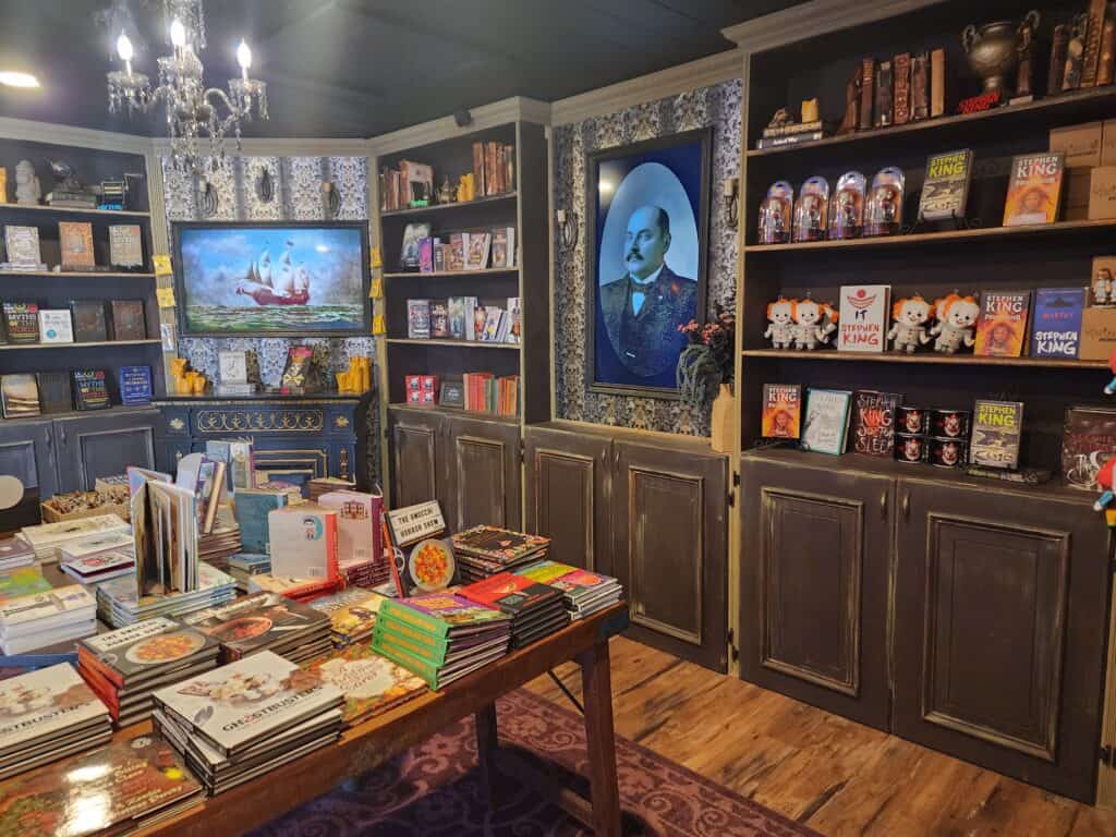 interior of a cozy, unique bookshop with a haunted and fantasy theme