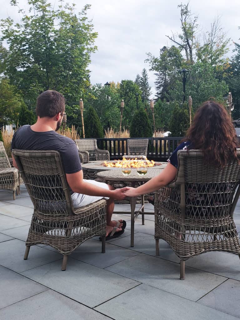 A couple holds hands at the Kimpton Taconic Hotel in Manchester, Vermont
