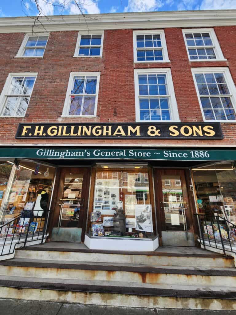 exterior of f.h. gillingham & sons general store in woodstock, vermont - a brick building 