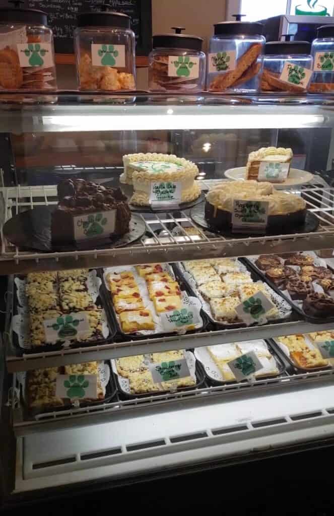 a bakery case filled with cake and pastries